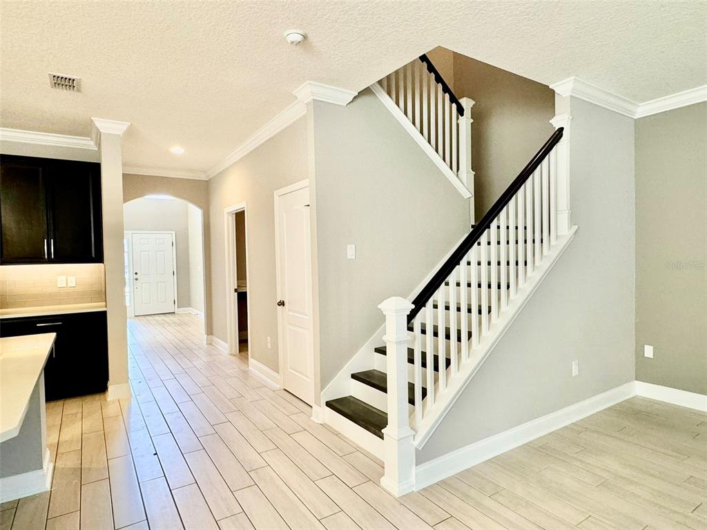 12411 Northover Loop Orlando, FL 32824 - Photo 10 of 13 a view of entryway and hall with wooden floor