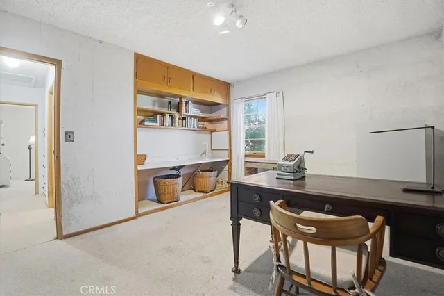 a room with a table and chairs