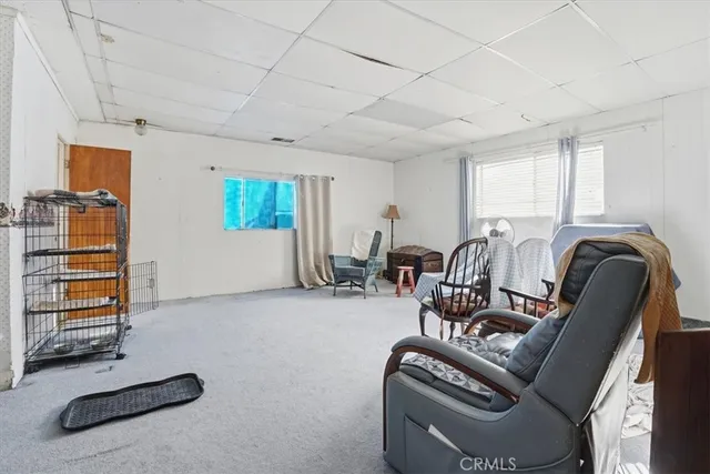 a view of a livingroom with furniture and windows