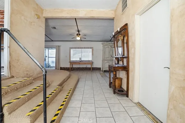 a view of a chair and table in a room