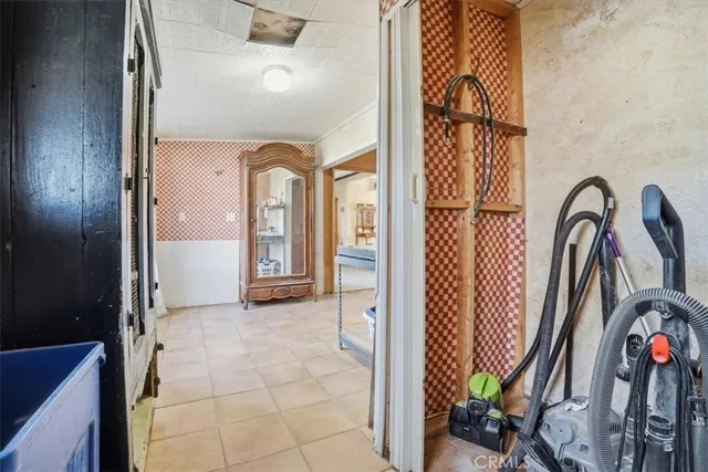 a view of a porch with furniture and a yard