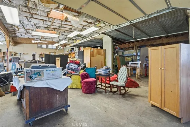 a living room with lots of furniture and a chandelier