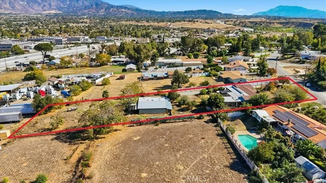 an aerial view of a house with a garden and plants