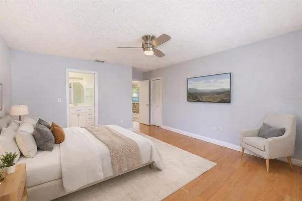 a bedroom with a bed and a couch
