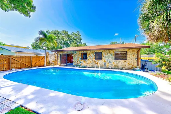 a view of pool with outdoor seating