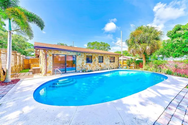 a view of outdoor space and swimming pool