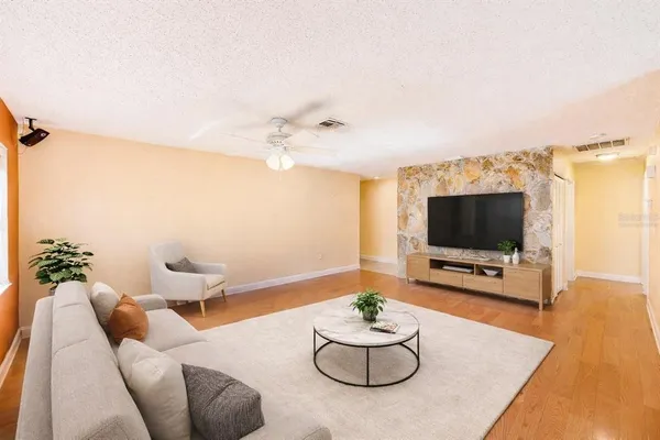 a living room with furniture and a flat screen tv
