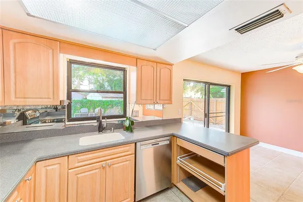 a kitchen with a sink and a window