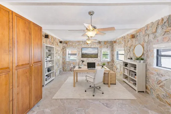 a living room with furniture a dining table and chairs