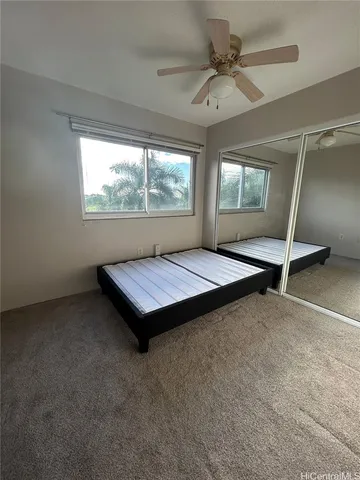 a room with pool table and windows