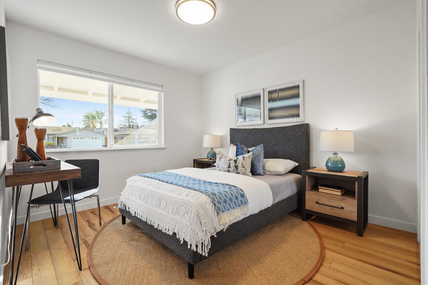 545 Sobrato Drive Campbell, CA 95008 - Photo 13 of 32 a bedroom with a bed and a table