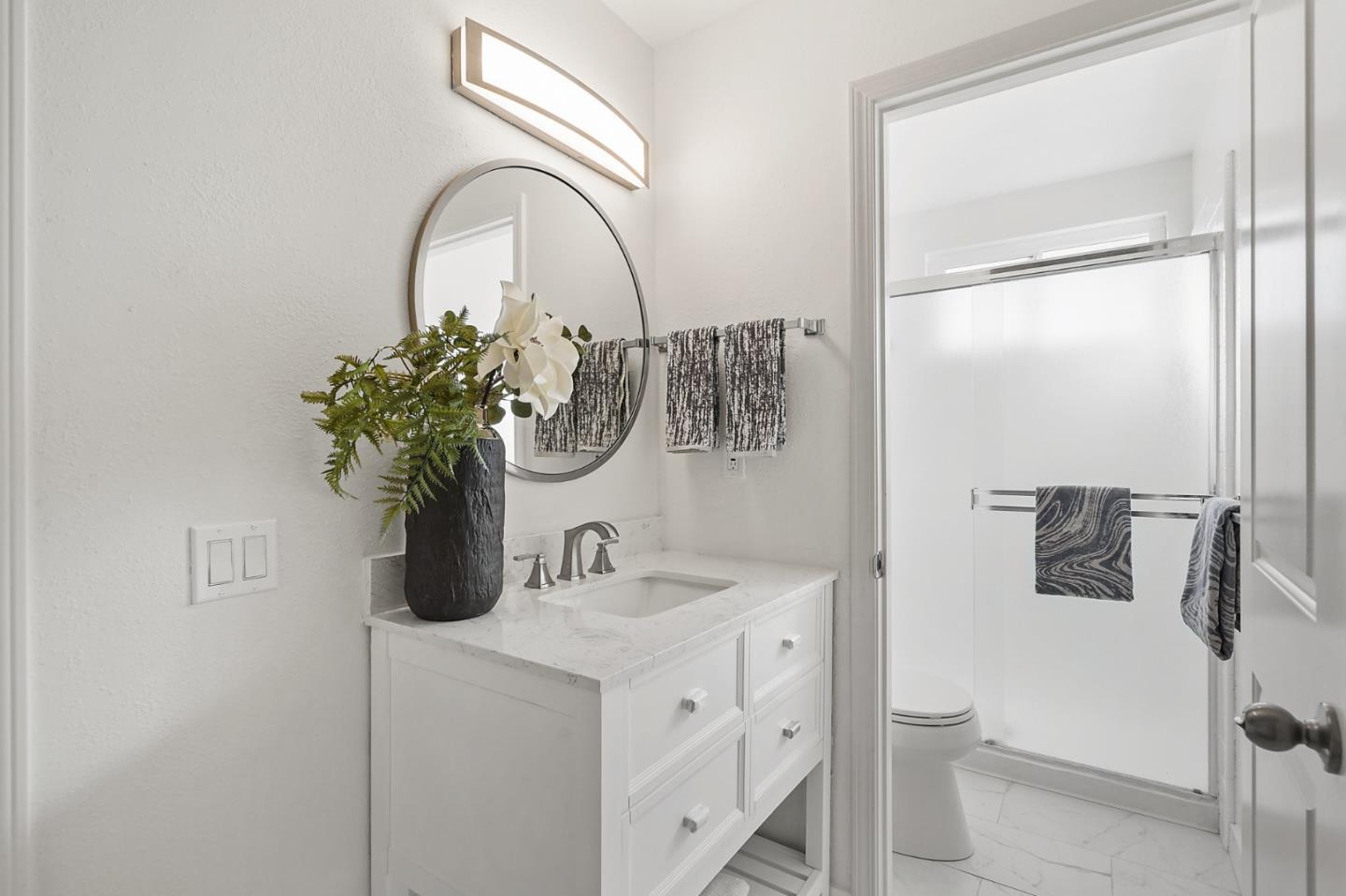 545 Sobrato Drive Campbell, CA 95008 - Photo 15 of 32 a bathroom with a sink and mirror with toilet