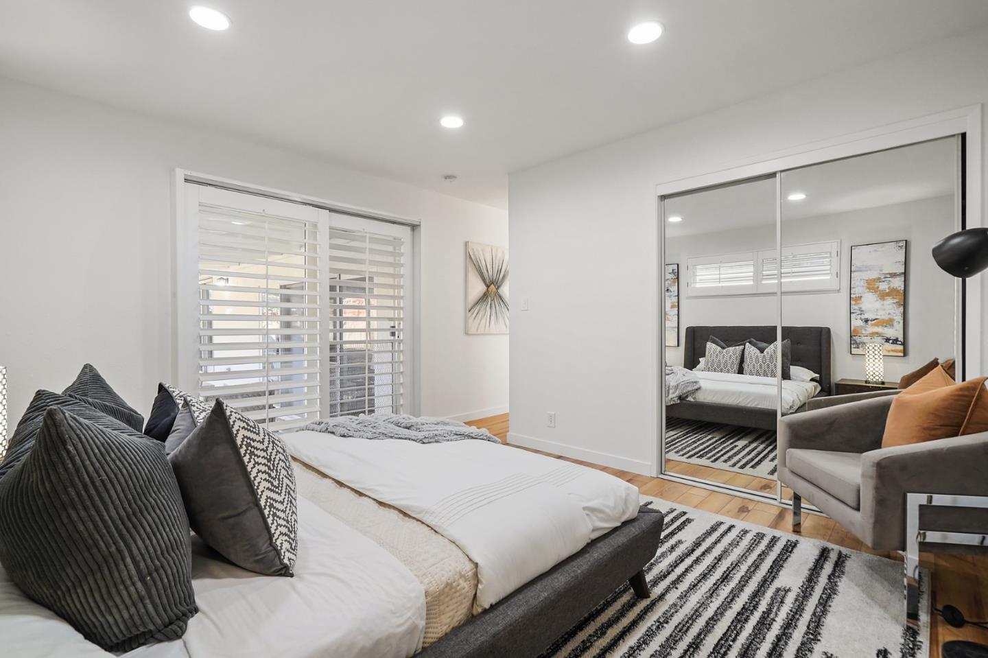 545 Sobrato Drive Campbell, CA 95008 - Photo 18 of 32 a bedroom with a bed and wooden floor