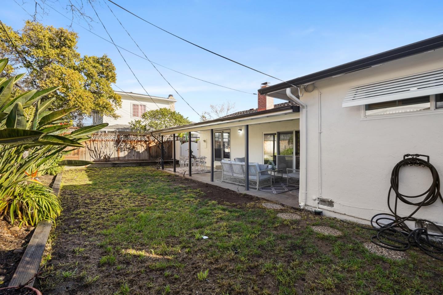 545 Sobrato Drive Campbell, CA 95008 - Photo 24 of 32 a backyard of a house with barbeque oven table and chairs