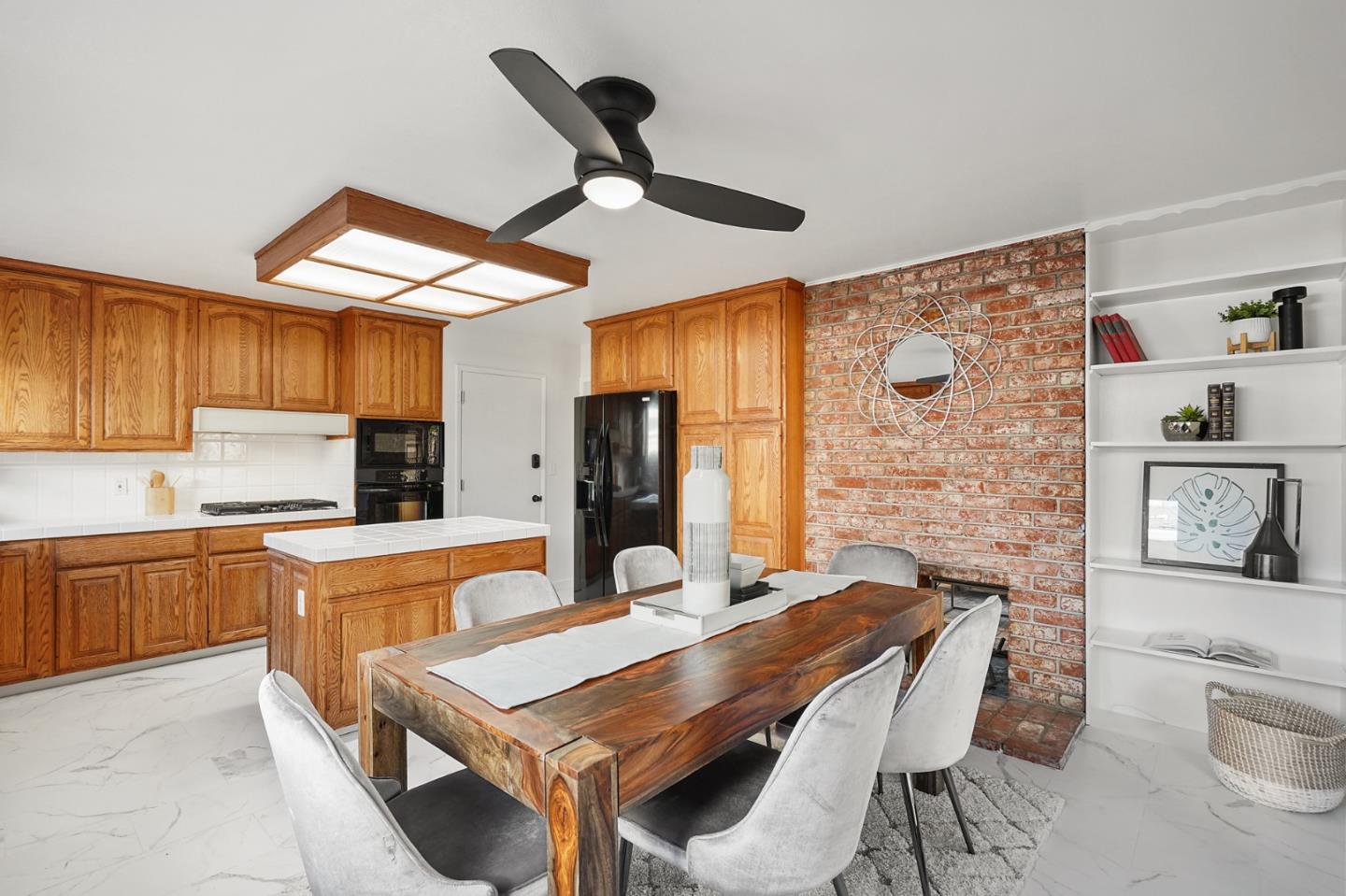 545 Sobrato Drive Campbell, CA 95008 - Photo 9 of 32 a kitchen with stainless steel appliances a table chairs and a refrigerator