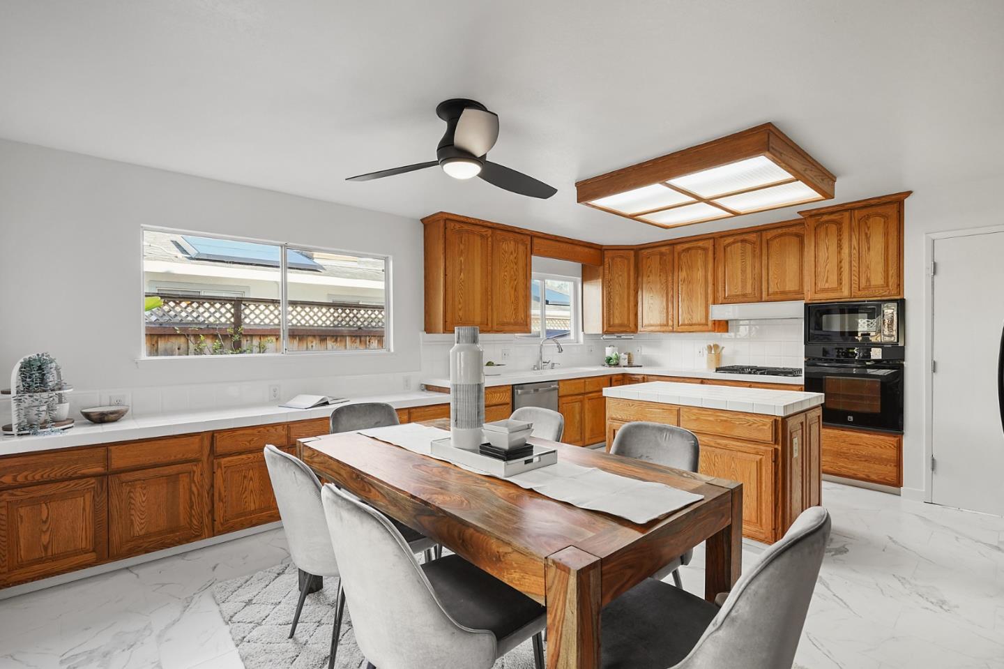 545 Sobrato Drive Campbell, CA 95008 - Photo 10 of 32 a kitchen with a stove a sink and a refrigerator
