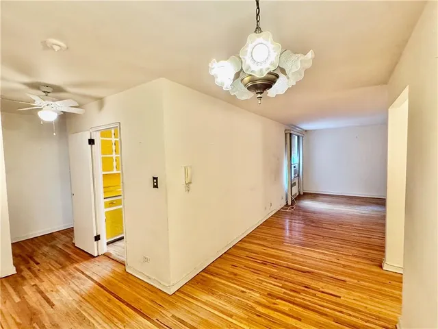 a view of a kitchen with a sink and a refrigerator