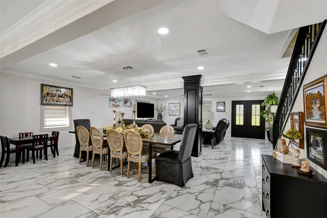 a living room with lots of furniture and a flat screen tv