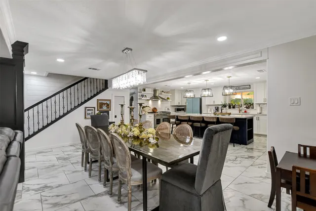 a room with furniture a piano and a bookshelf