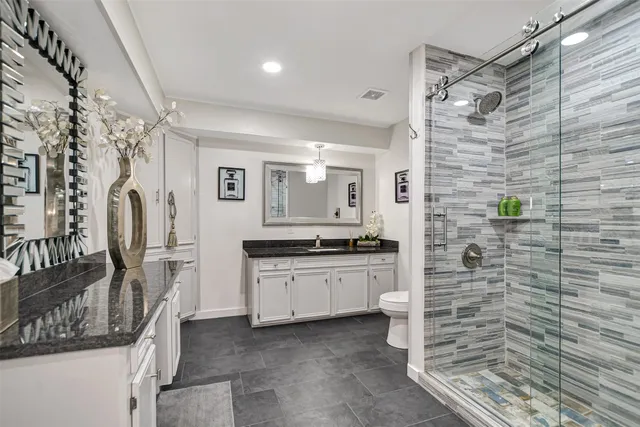 a living room with furniture a rug and a clock