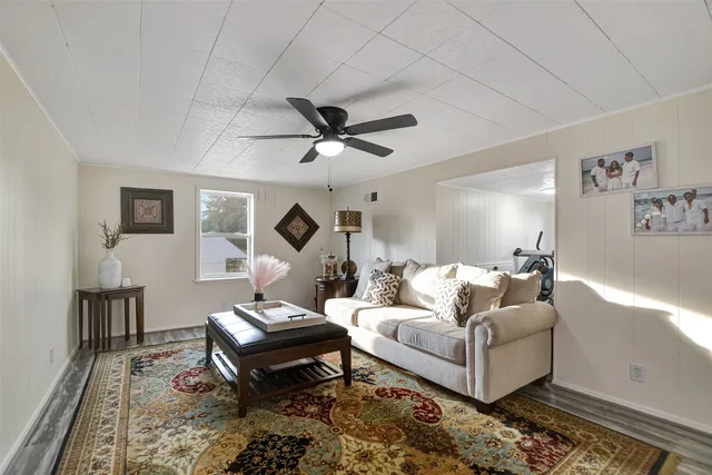 a living room with furniture and a rug