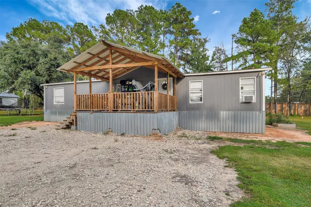 a view of a dining room with furniture kitchen and wooden floor