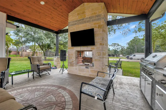 a view of an chairs and table in the patio