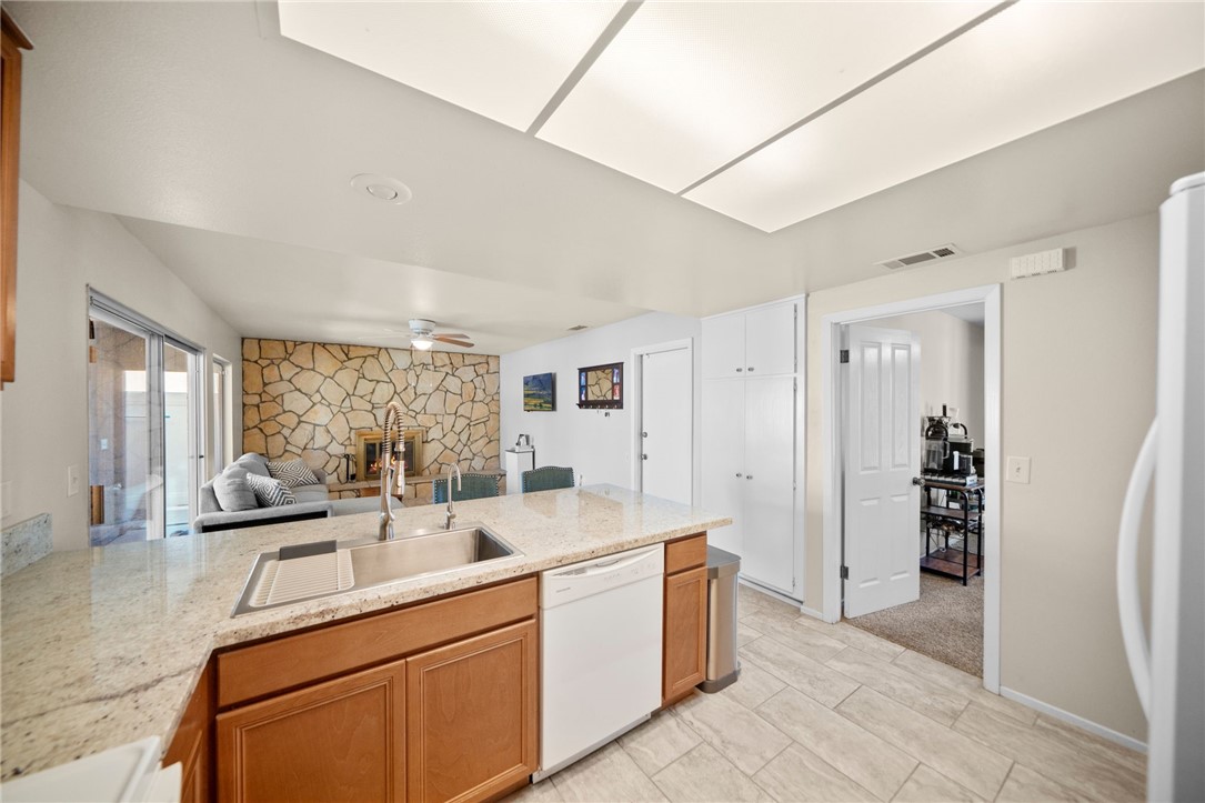 27879 Foxfire Street Menifee, CA 92586 - Photo 15 of 36 a room with a sink and a refrigerator
