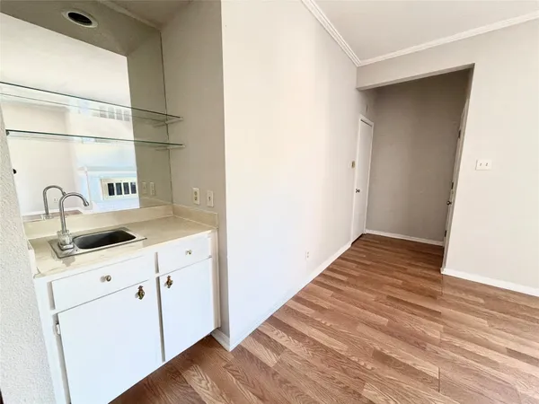 a kitchen with a sink and cabinets