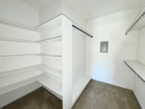 a view of an empty walk in closet