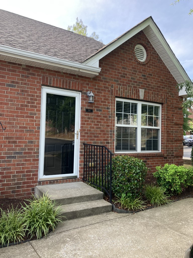 1101 Downs Boulevard, Unit 90 Franklin, TN 37064 - Photo 2 of 2 a front view of a house