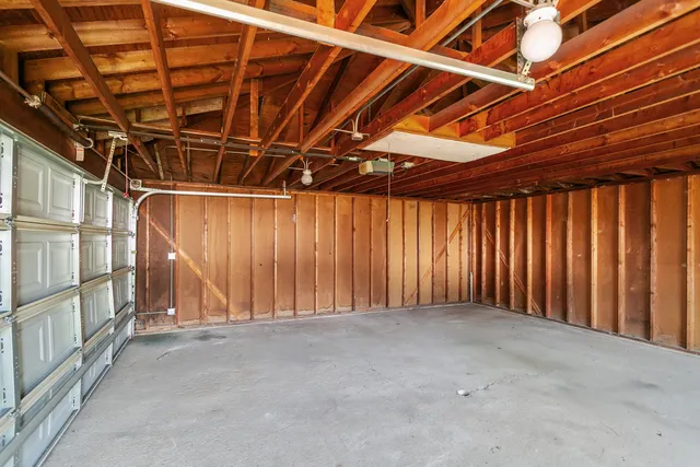 a view of an empty room with wooden walls