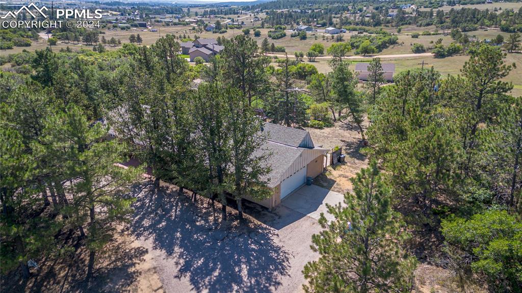 2915 Mt Herman Road Monument, CO 80132 - Photo 1 of 39 an aerial view of house with yard and mountain view in back