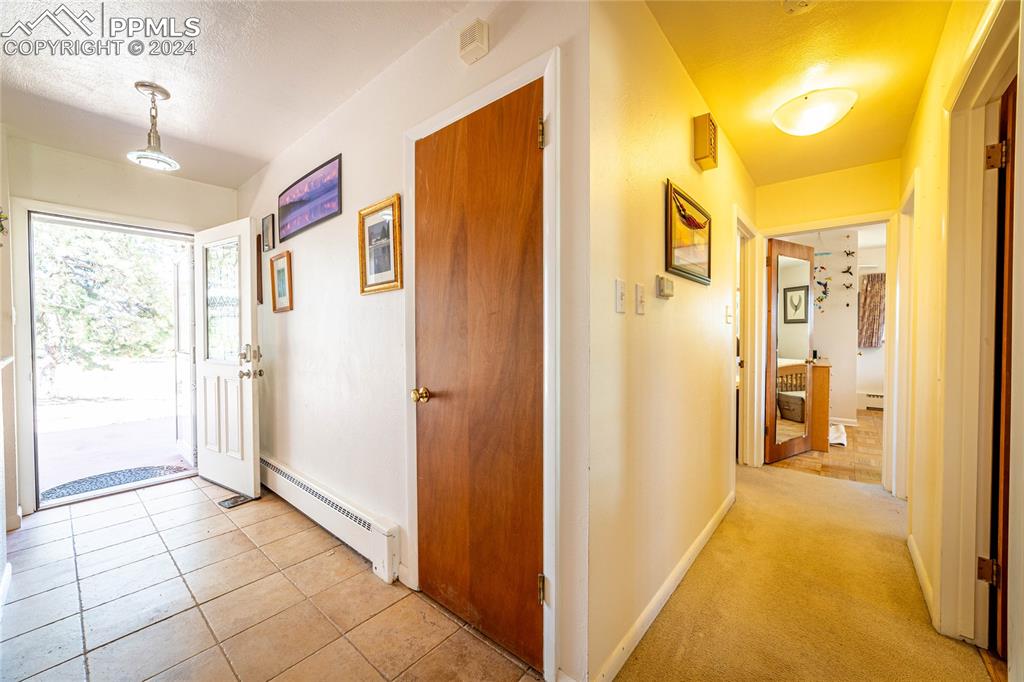 2915 Mt Herman Road Monument, CO 80132 - Photo 11 of 39 a view of a hallway with a bathroom
