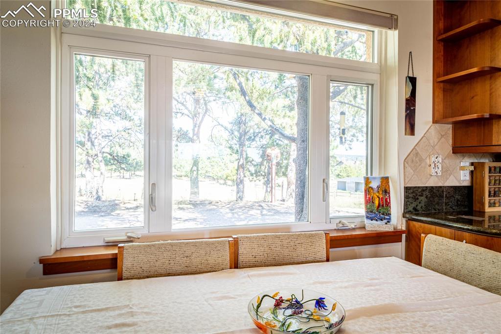 2915 Mt Herman Road Monument, CO 80132 - Photo 16 of 39 a large living room with a large window