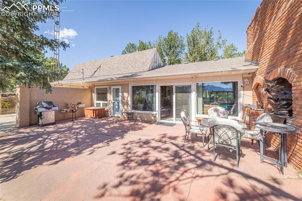 2915 Mt Herman Road Monument, CO 80132 - Photo 33 of 39 a view of a house with backyard and sitting area