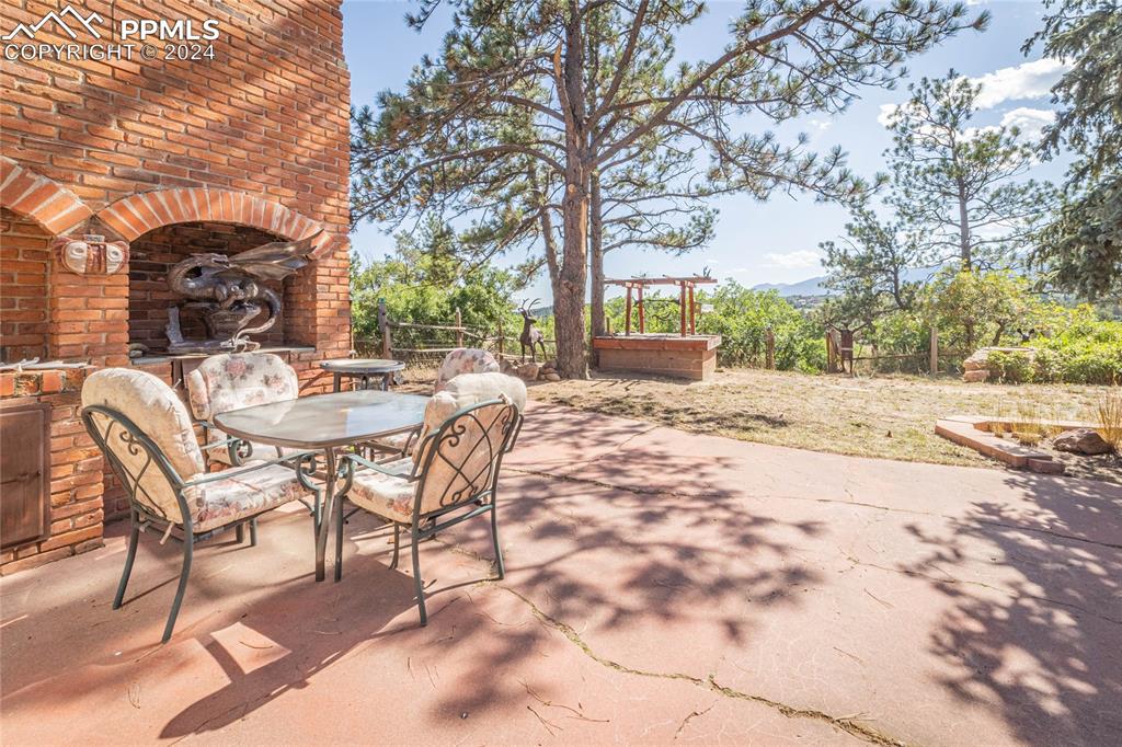 2915 Mt Herman Road Monument, CO 80132 - Photo 35 of 39 a patio with a yard and seating space