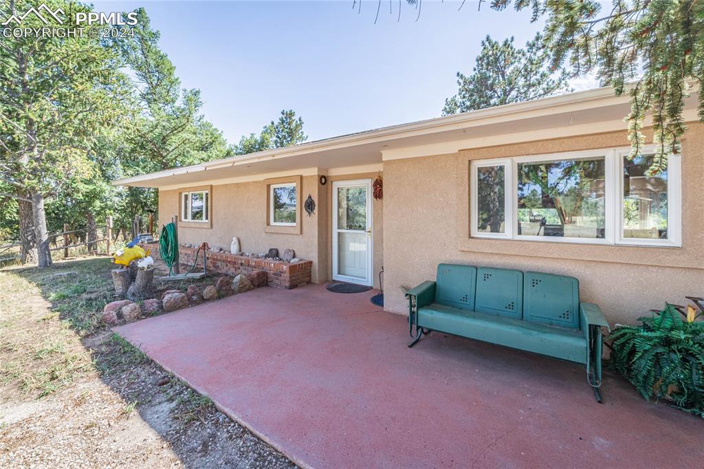 2915 Mt Herman Road Monument, CO 80132 - Photo 10 of 39 a view of a house with backyard and sitting area