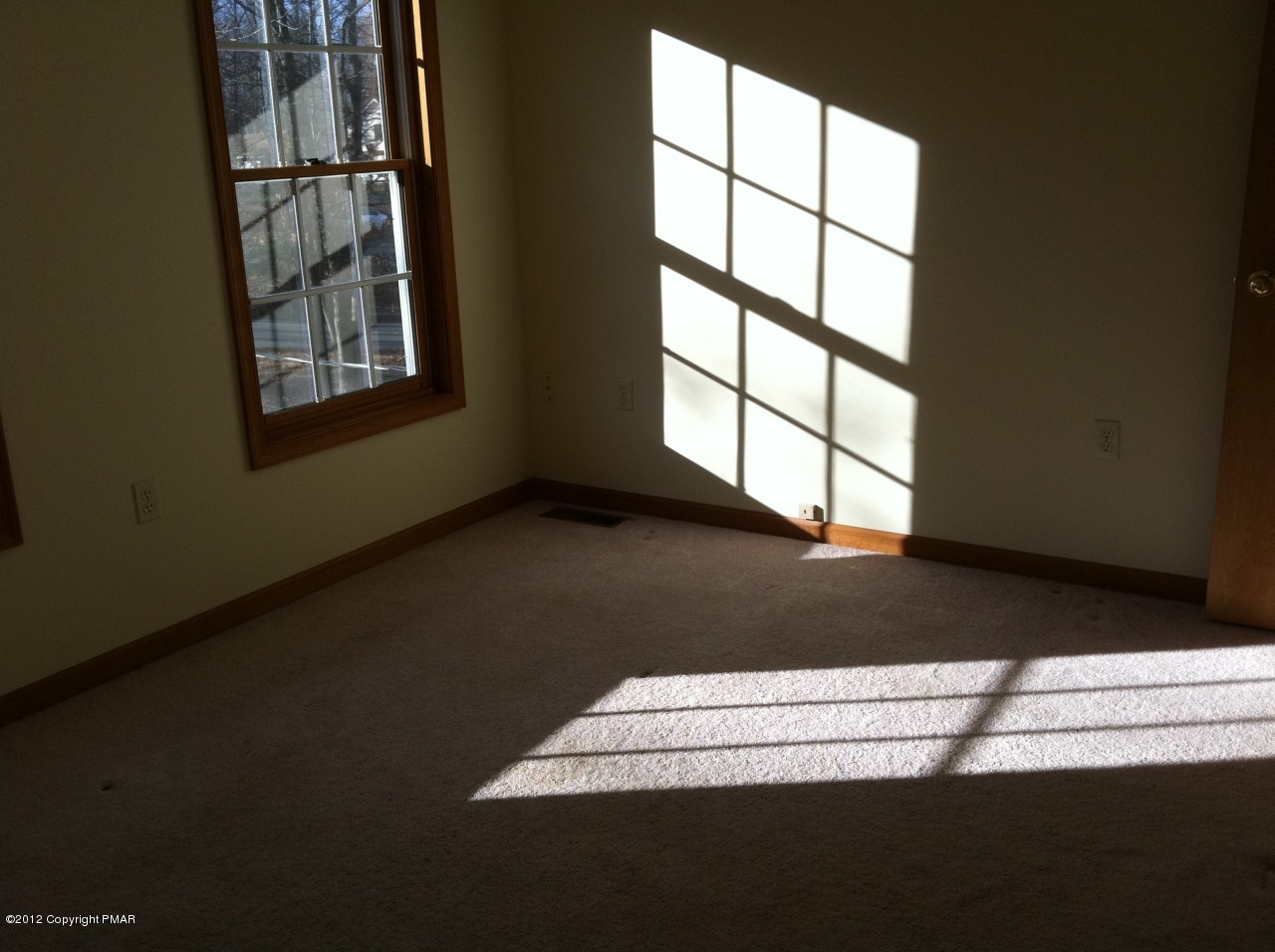 141 Rodeo Drive Hawley, PA 18428 - Photo 11 of 17 a view of wooden floor and windows in a room