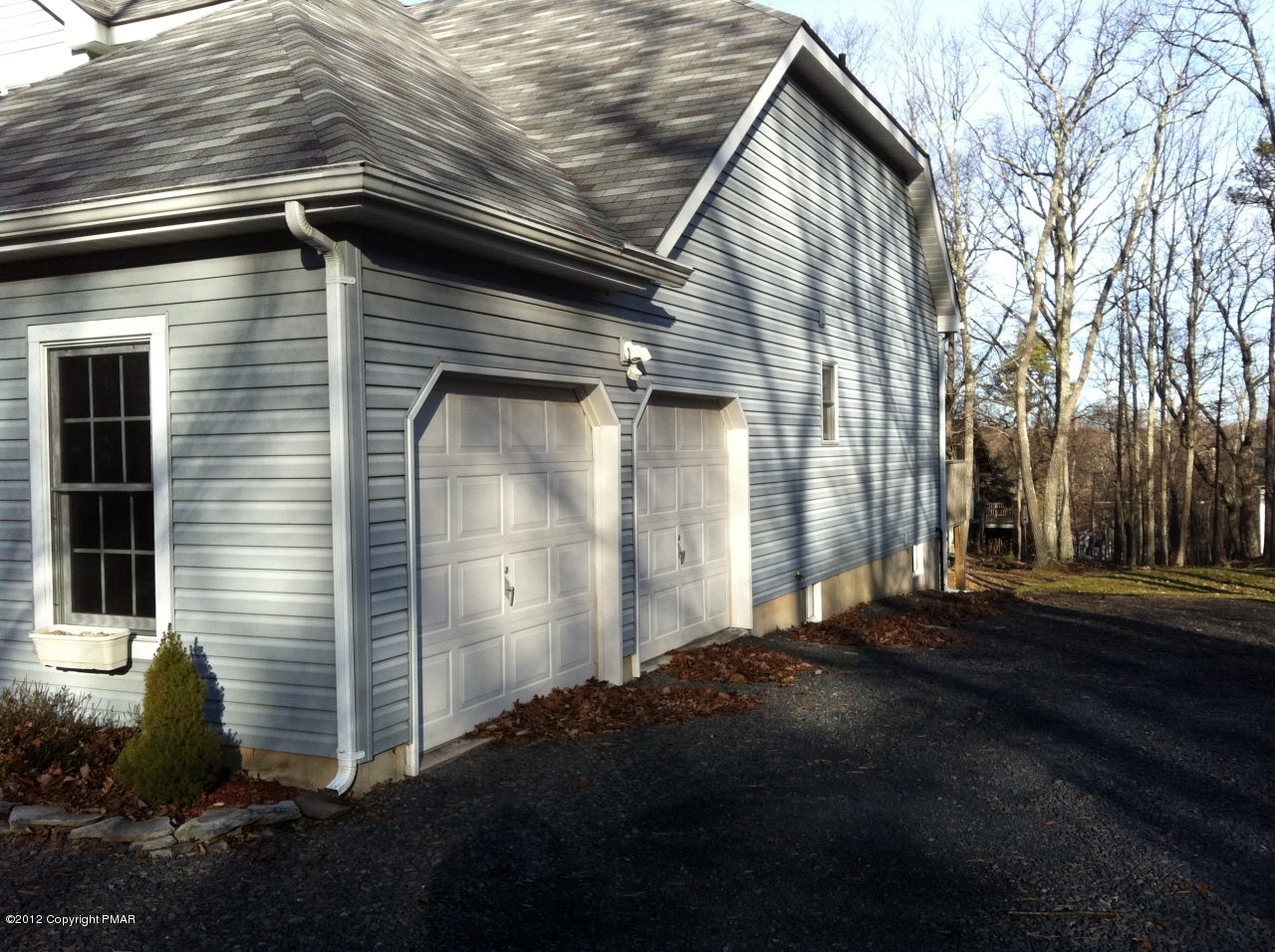 141 Rodeo Drive Hawley, PA 18428 - Photo 15 of 17 a front view of a house with a yard