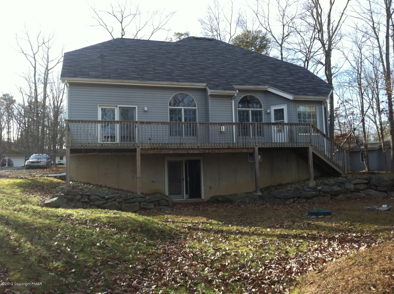 141 Rodeo Drive Hawley, PA 18428 - Photo 16 of 17 a front view of a house with a yard
