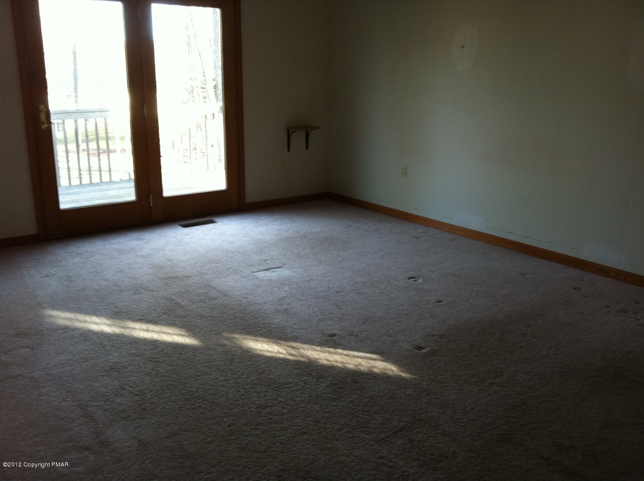 141 Rodeo Drive Hawley, PA 18428 - Photo 7 of 17 a view of an empty room with a window