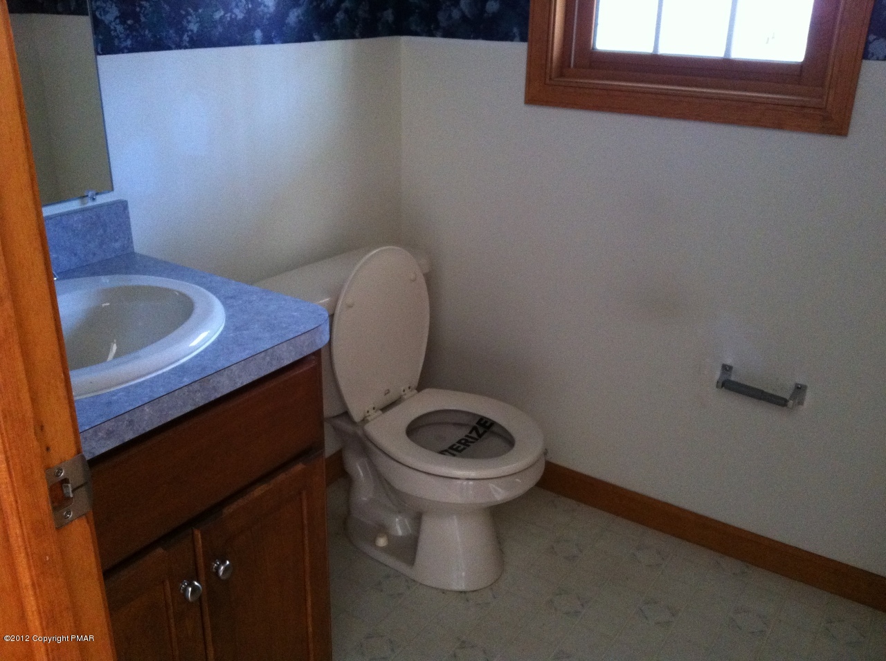 141 Rodeo Drive Hawley, PA 18428 - Photo 9 of 17 a toilet sitting in a bathroom next to a sink
