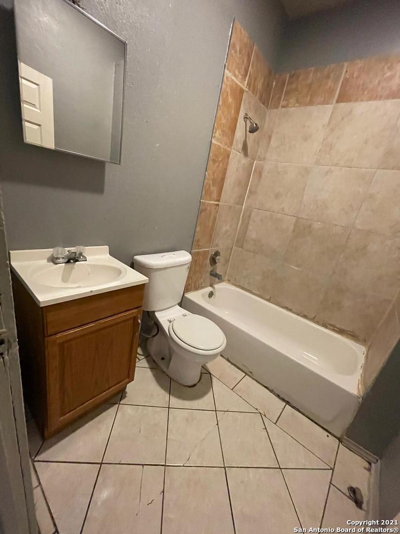 730 Carolina Street, Unit 1 San Antonio, TX 78210 - Photo 8 of 9 a bathroom with a sink toilet and shower