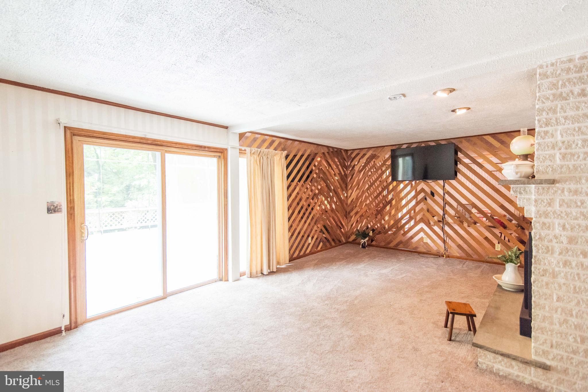 990 Quarry Road Gap, PA 17527 - Photo 15 of 62 Living room with slider door