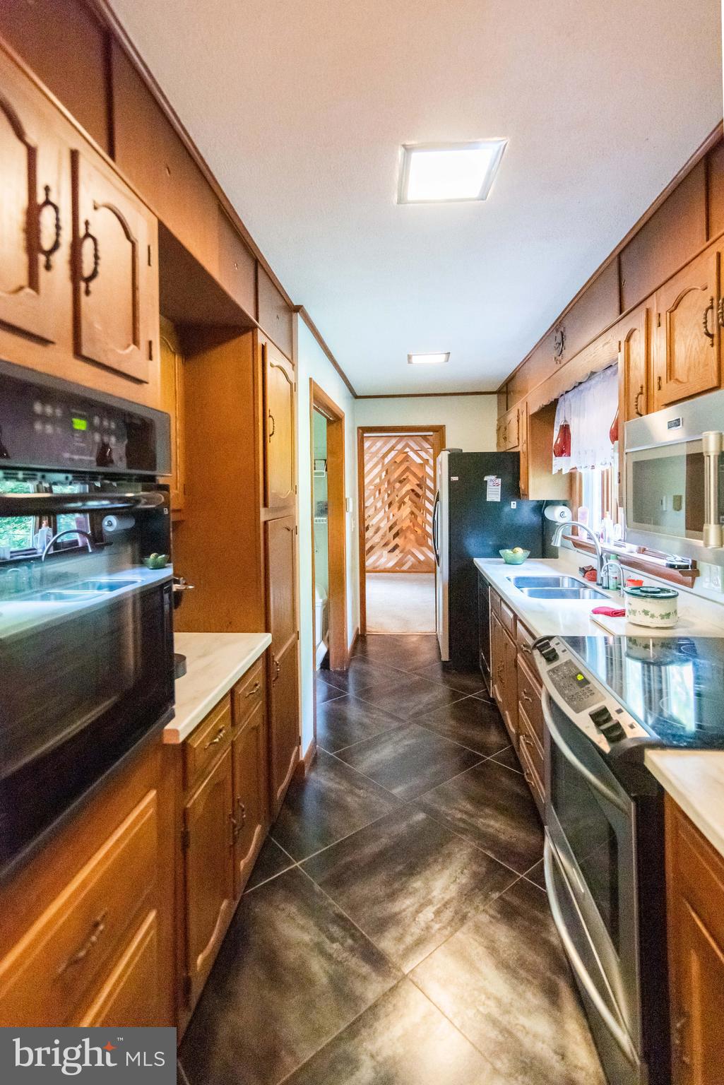 990 Quarry Road Gap, PA 17527 - Photo 23 of 62 Galley kitchen, gleaming heated tile floor