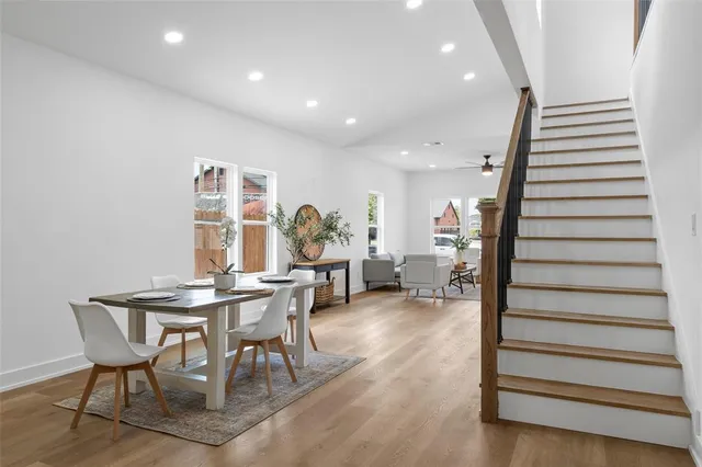 a view of a dining room with furniture and wooden floor