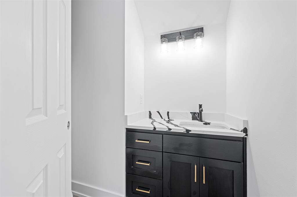 721 Taylor Street Waco, TX 76704 - Photo 14 of 28 a bathroom with a sink and a mirror