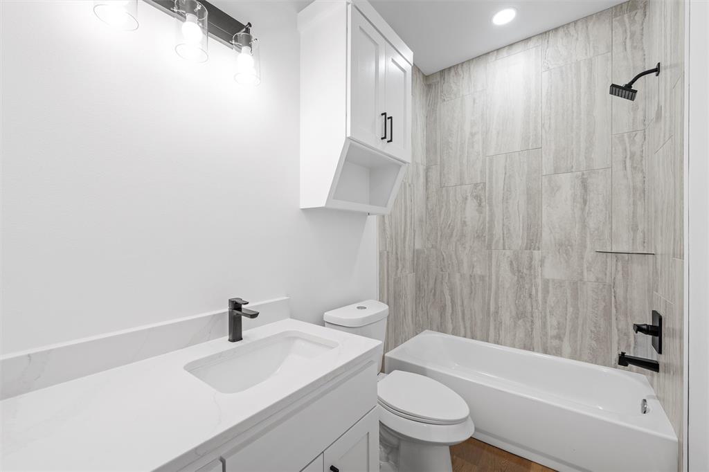 721 Taylor Street Waco, TX 76704 - Photo 21 of 28 a bathroom with a sink toilet and shower