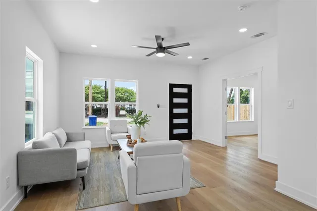 a living room with furniture and a large window